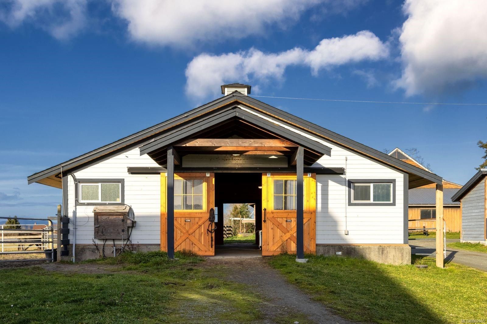 White Barn With Open Wooden Doors